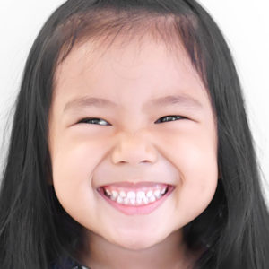 smiling asian preschooler at a Preschool & Daycare Serving Washington, DC